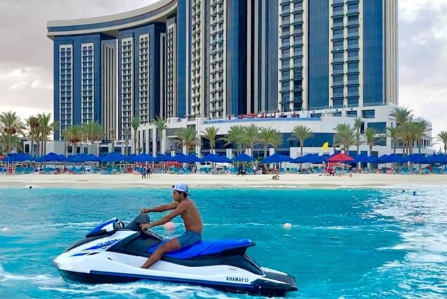 Jet Skiing by a Luxurious Beachfront Hotel