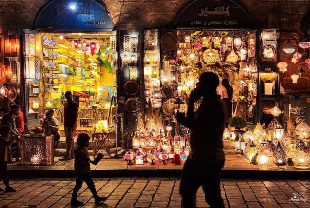 Vibrant street market at night with lanterns and decorative items