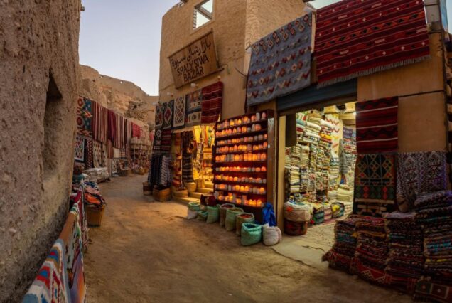 Traditional Egyptian bazaar with colorful rugs and spices in Siwa Oasis